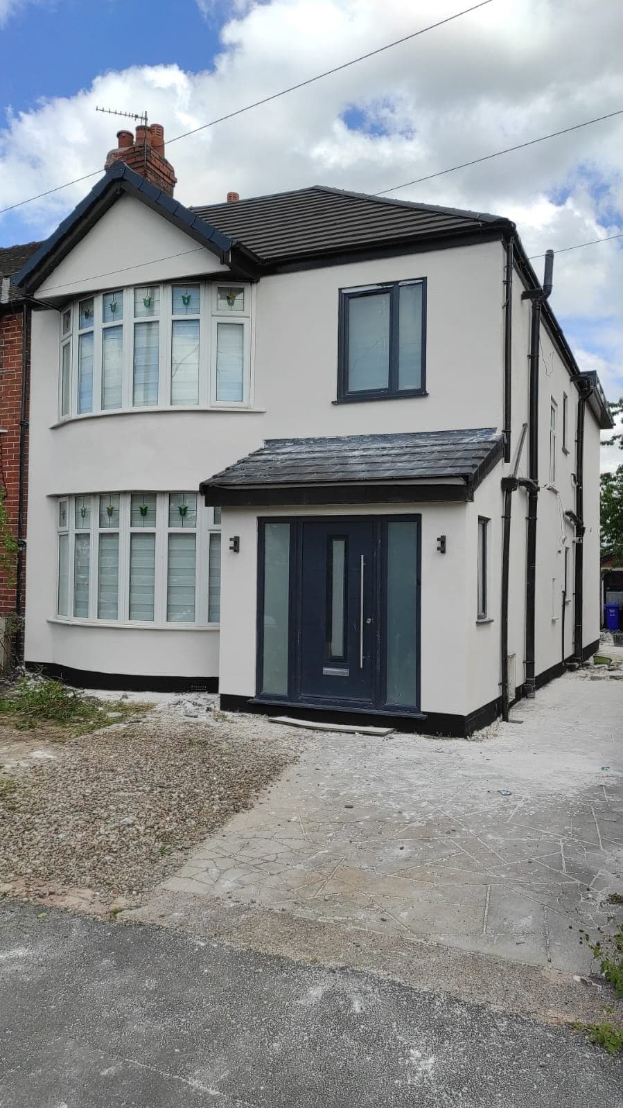 A fully renovated semi-detached home by Nova Rise, with new render, windows and front door